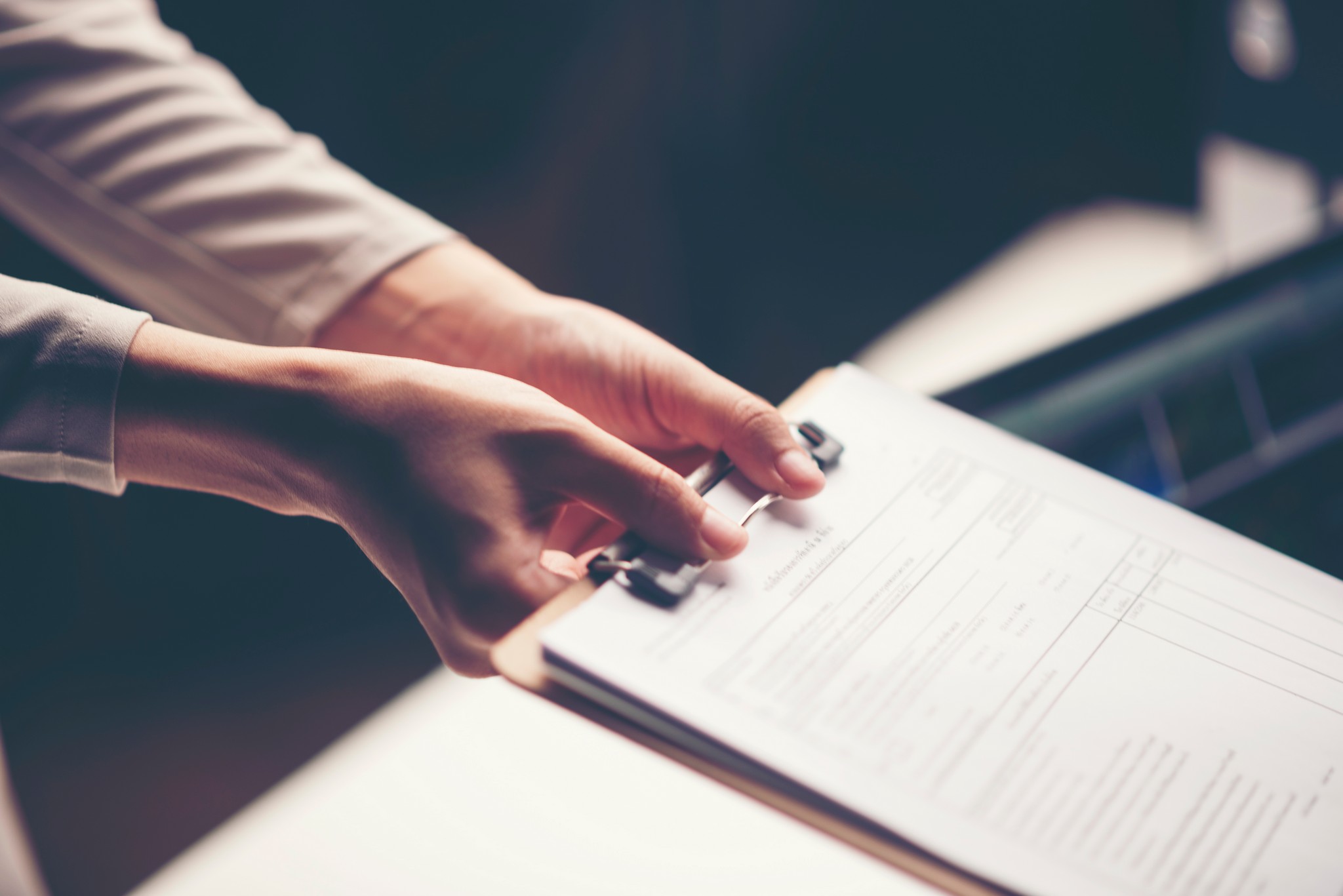 business document in hand of businessman