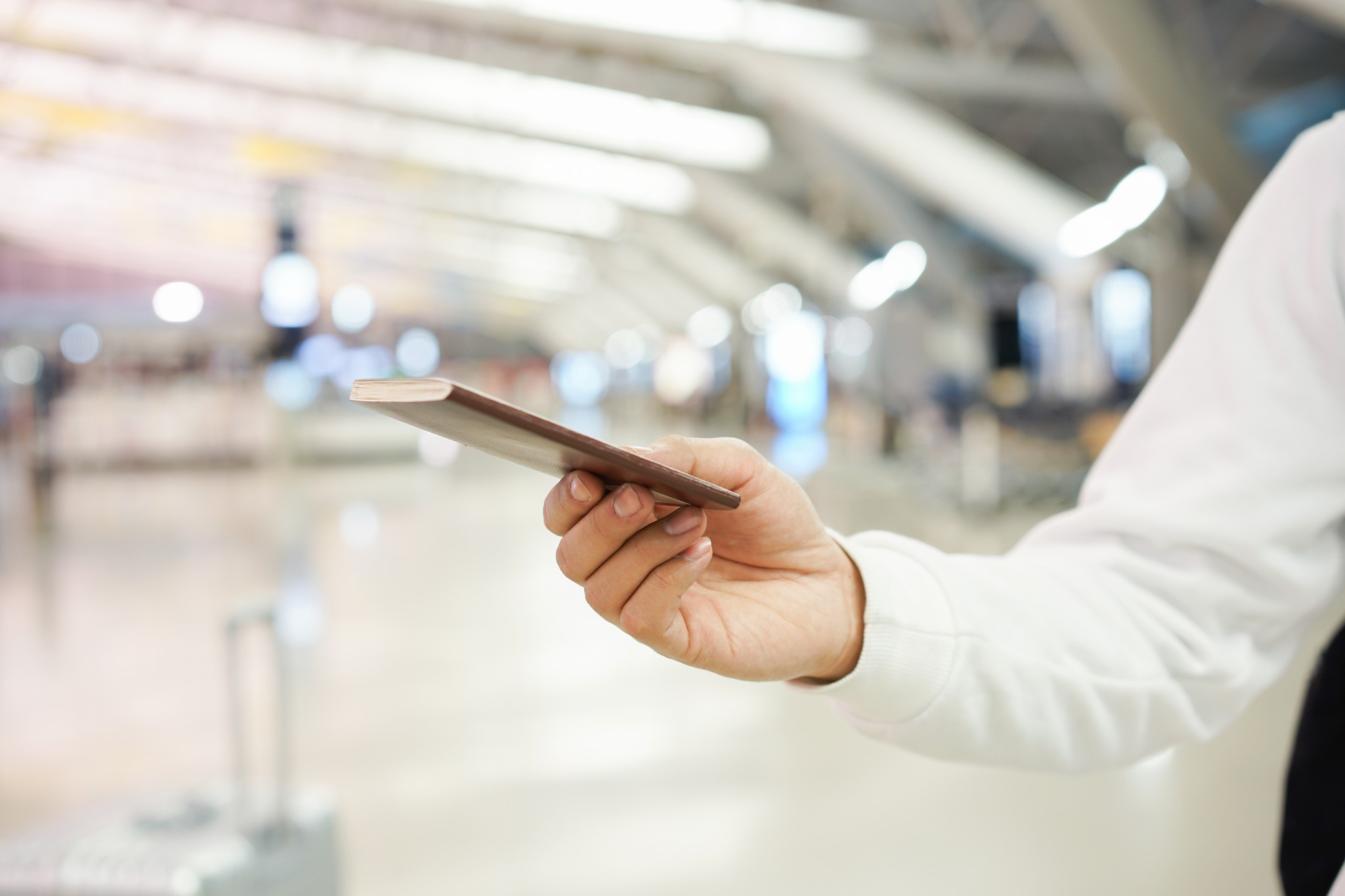 close up traveller man hand holding passport